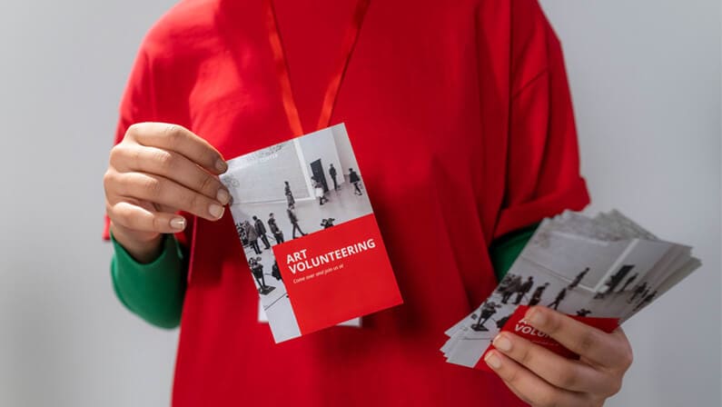holding a flyer
