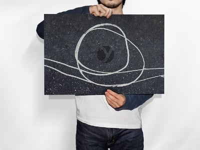 Man Holding Horizontal Poster PSD Mockup